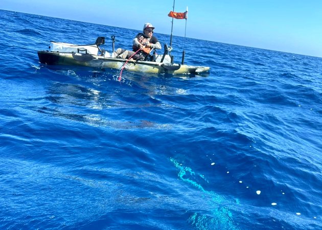 A kayak angler hooked up with a marlin.