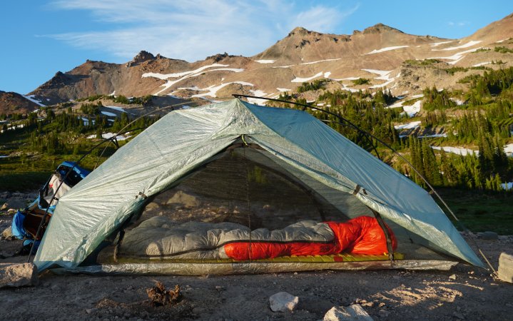  The Zpacks tent is set up in front of a mountain.