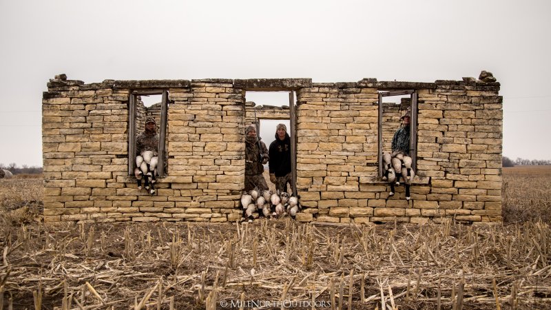 Hunters in an old stone house they used as a goose blind.