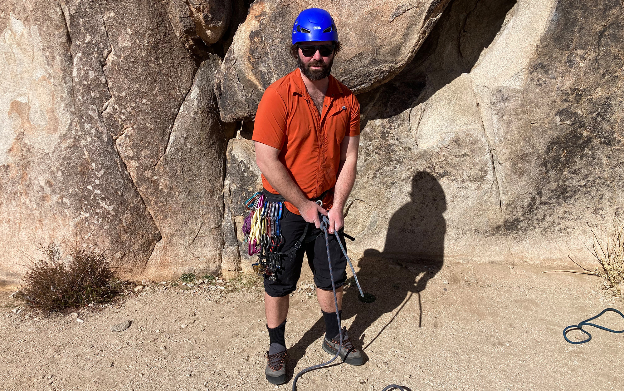 Author wears approach shoes at a crag.