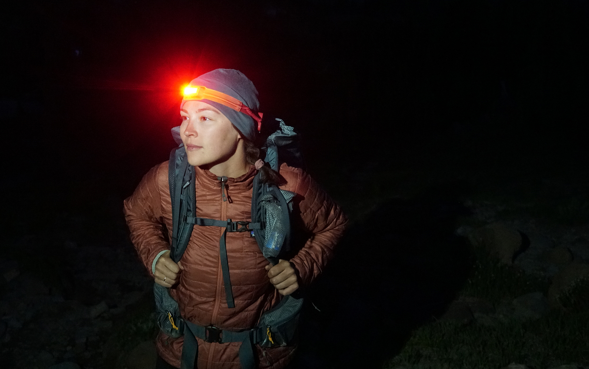 Hiker wears BioLite 425 headlamp.