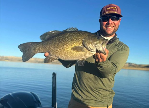 A North Dakota fishing guide with a big Montana smallmouth bass.