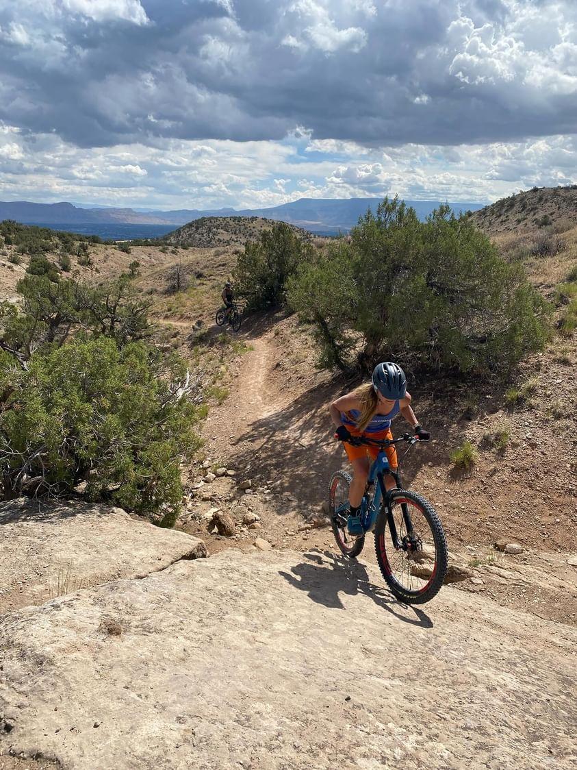 A woman, I Ling Thompson, mountain bikes on BLM land.