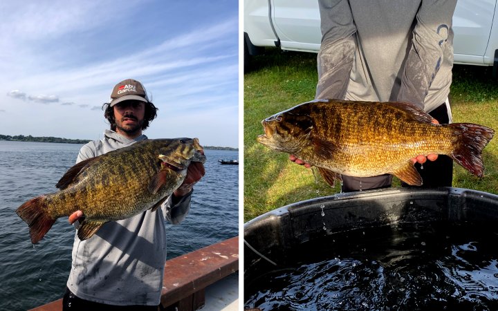 An angler holds up a giant smallmouth bass.