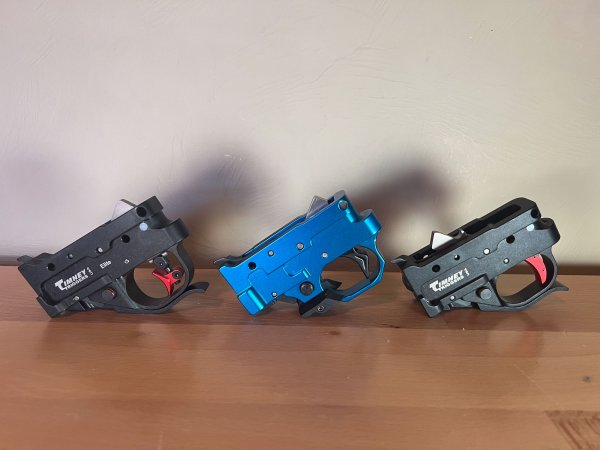 Three of the best ruger 10/22 triggers on a bench