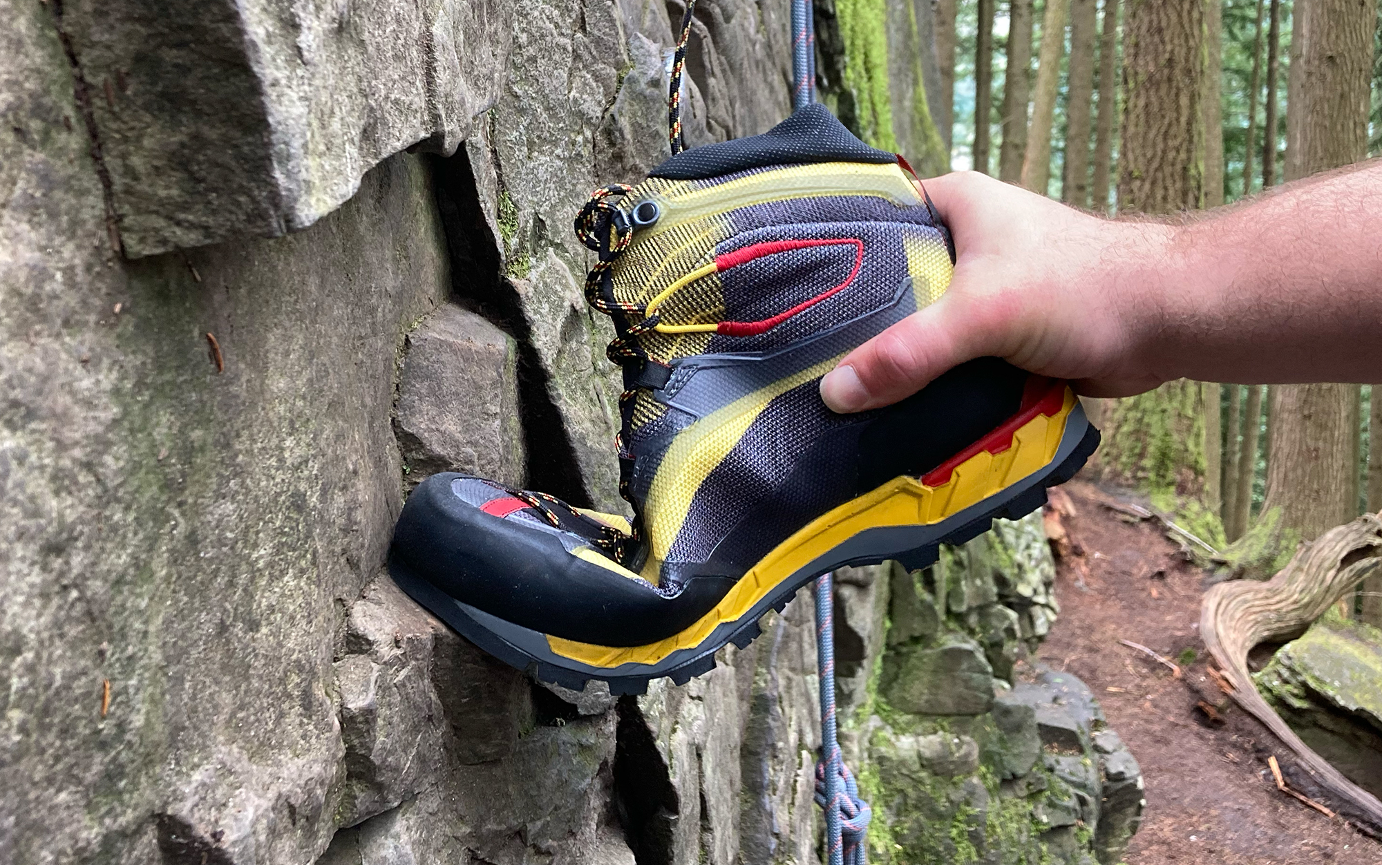 Author bends sole of the Trango against a rock.