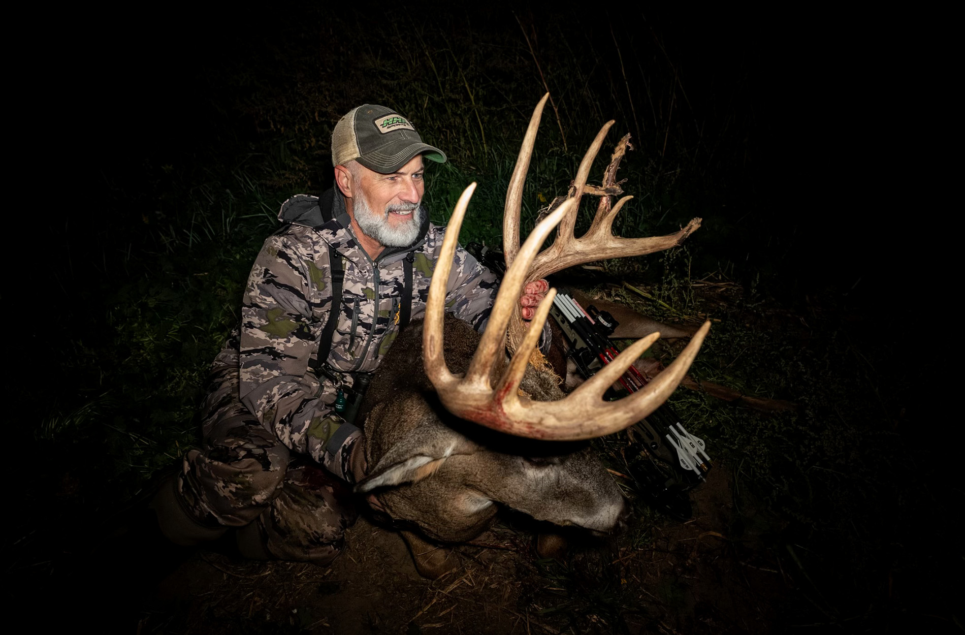 A Minnesota bowhunter looks at a whitetail buck.