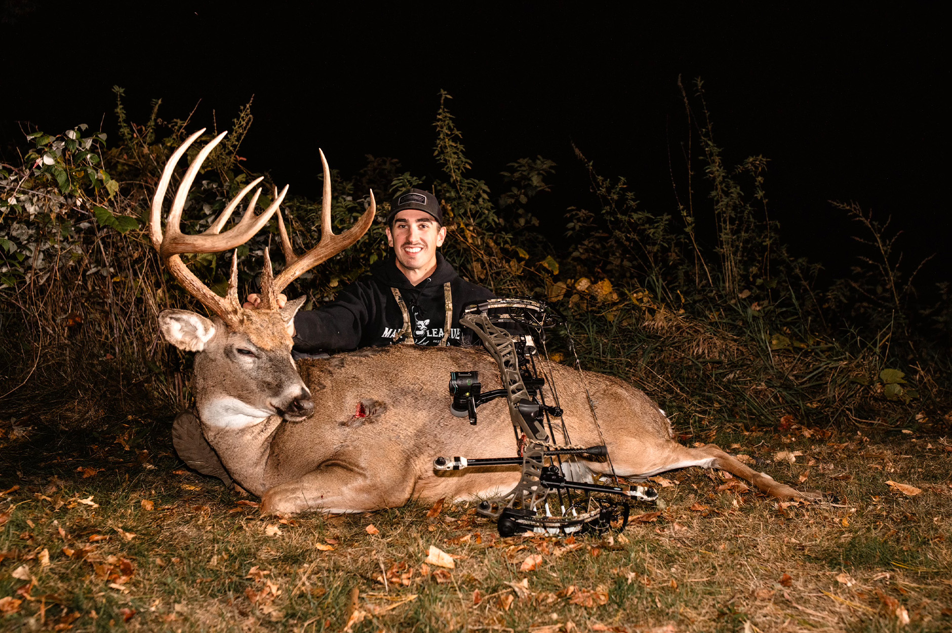 A Wiconsin bowhunter with a 14-point buck.