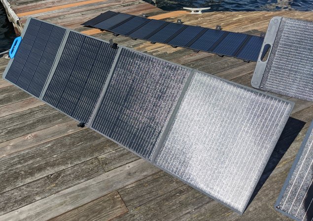 Portable solar panels lying on a dock in the sun