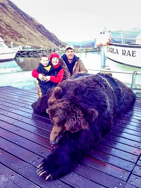 An Alaska guide and his family with a brown bear taken with a .308.