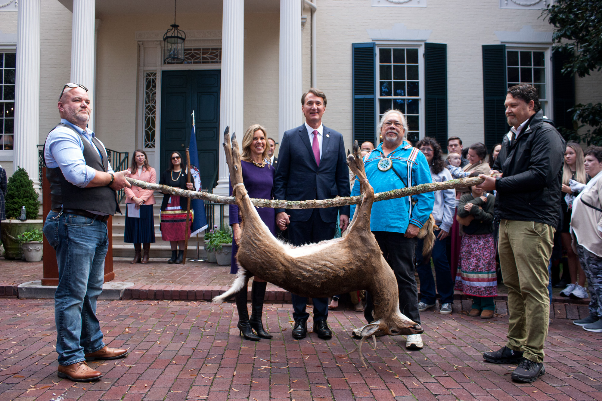 Governor Youngkin poses with one of the deer tax tributes.