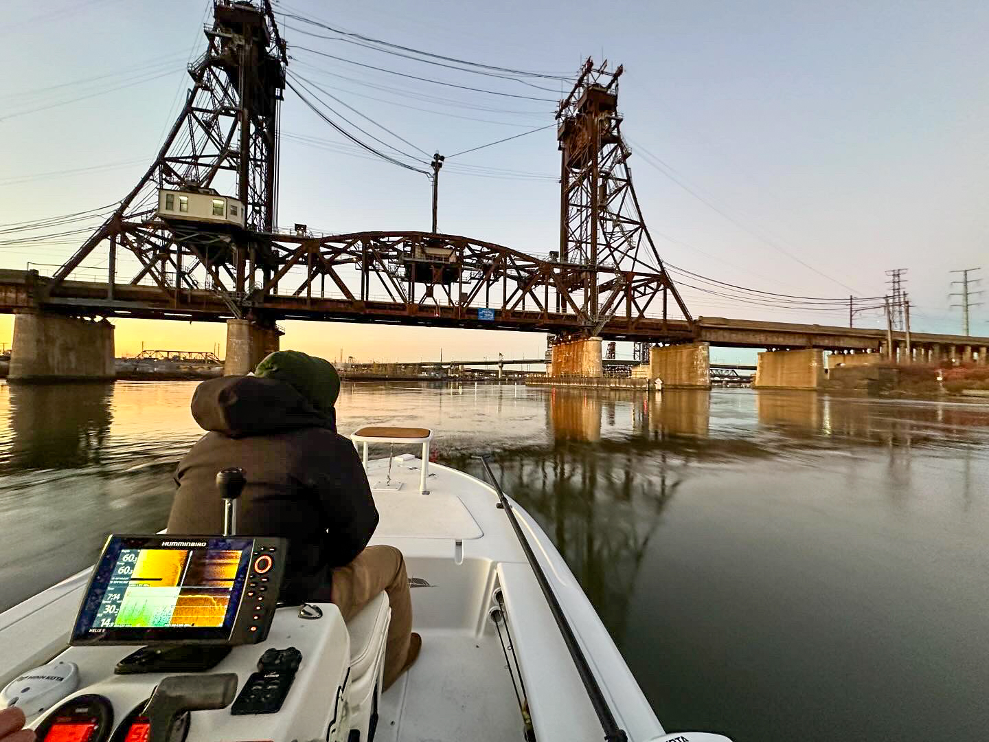 Approaching an overpass in a fishing boat.