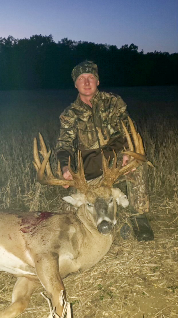 A hunter with a 30-point buck.