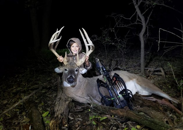 A youth hunter with his first buck.