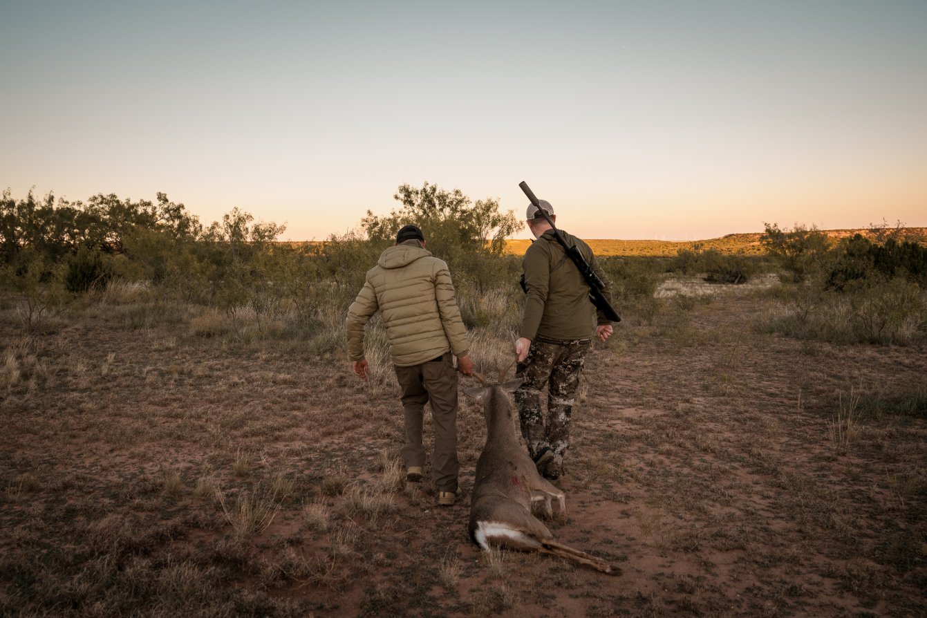 Freel and Miller Drag a Buck