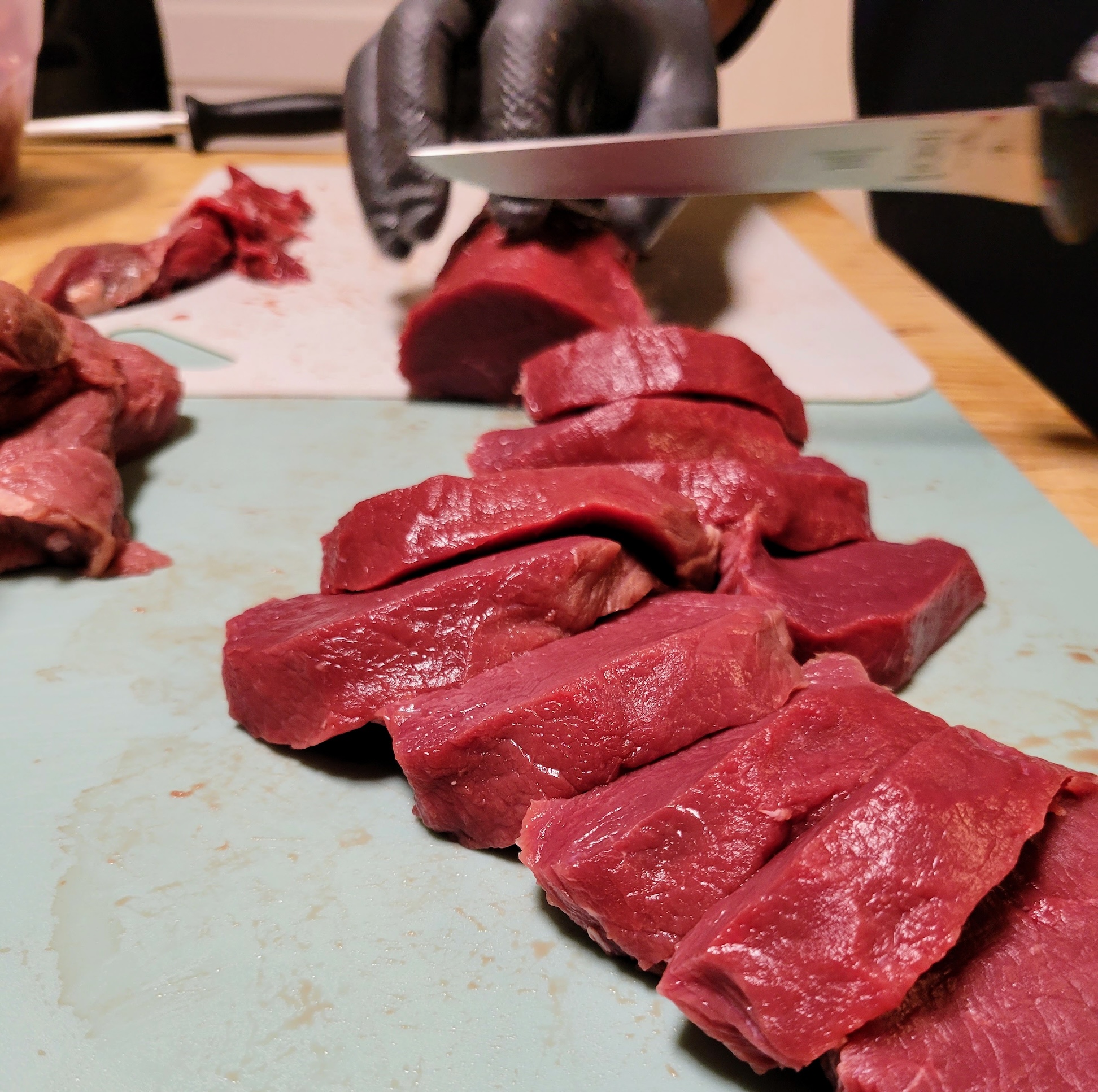 A close-up of slices of venison backstrap.