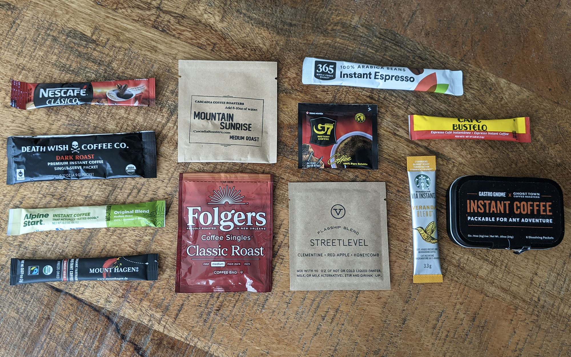 various packets of instant coffee lined up on a table