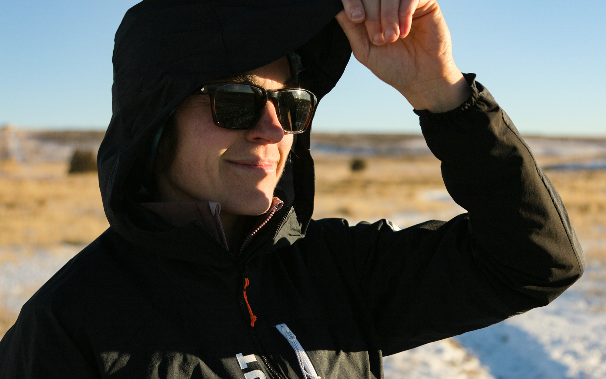 Tester wears hood on the Mammut Aenergy.