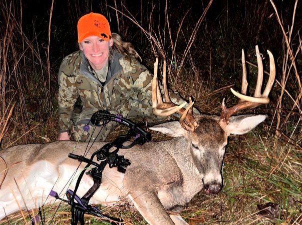 A bowhunter with a big Indiana buck.