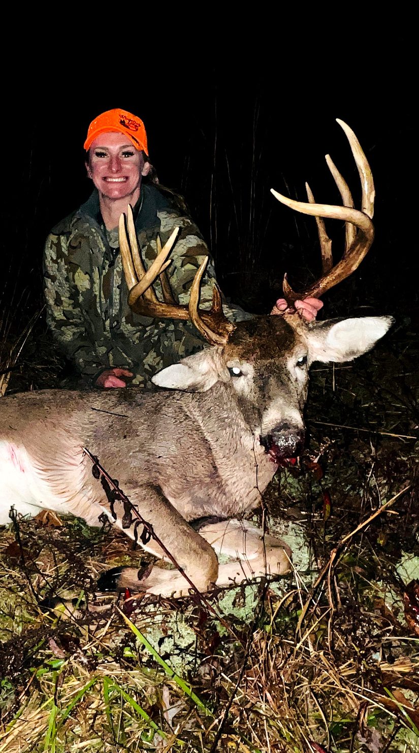 A bowhunter with a 13-point buck.