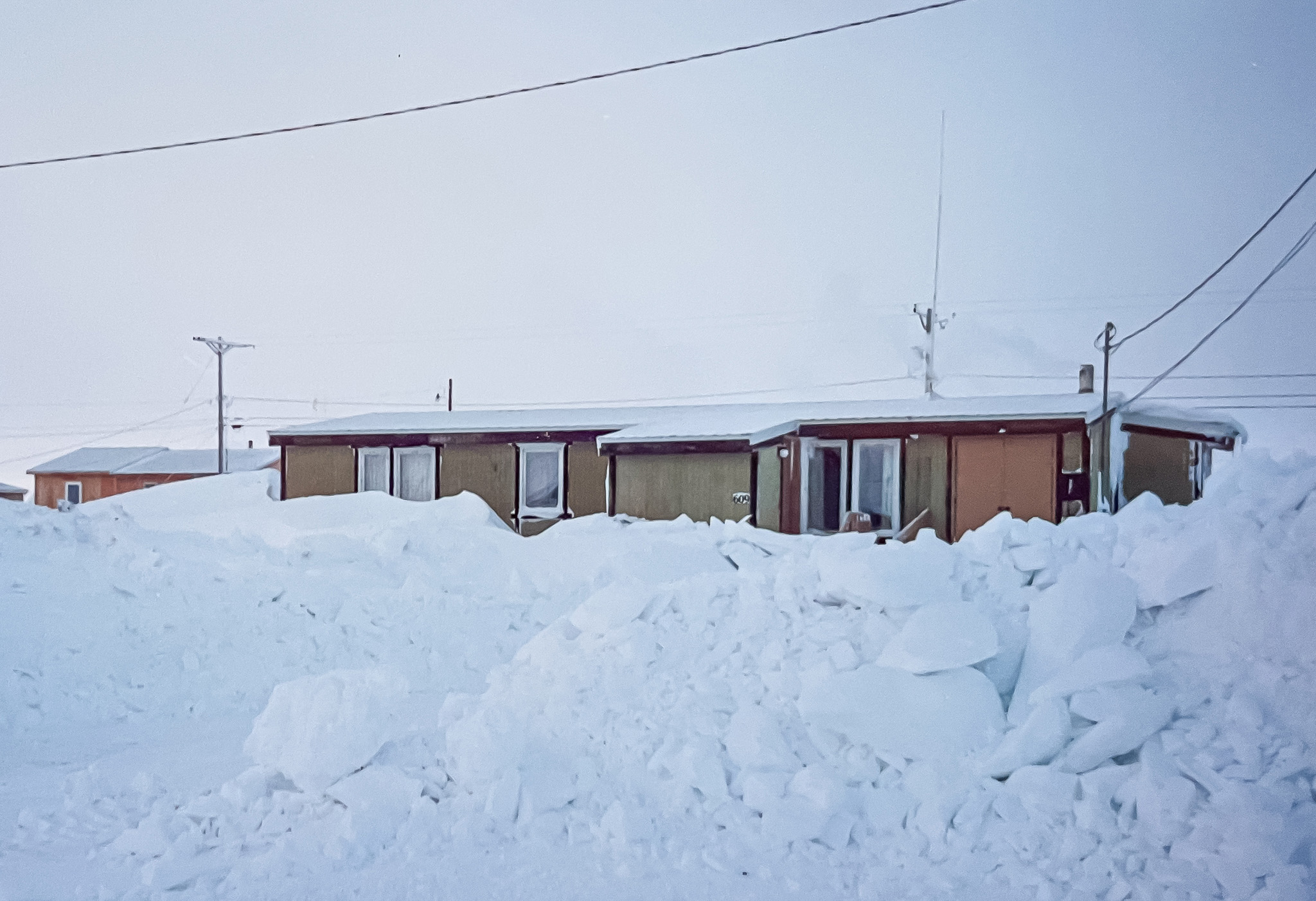 A snow covered house in Point Lay, Alaska.