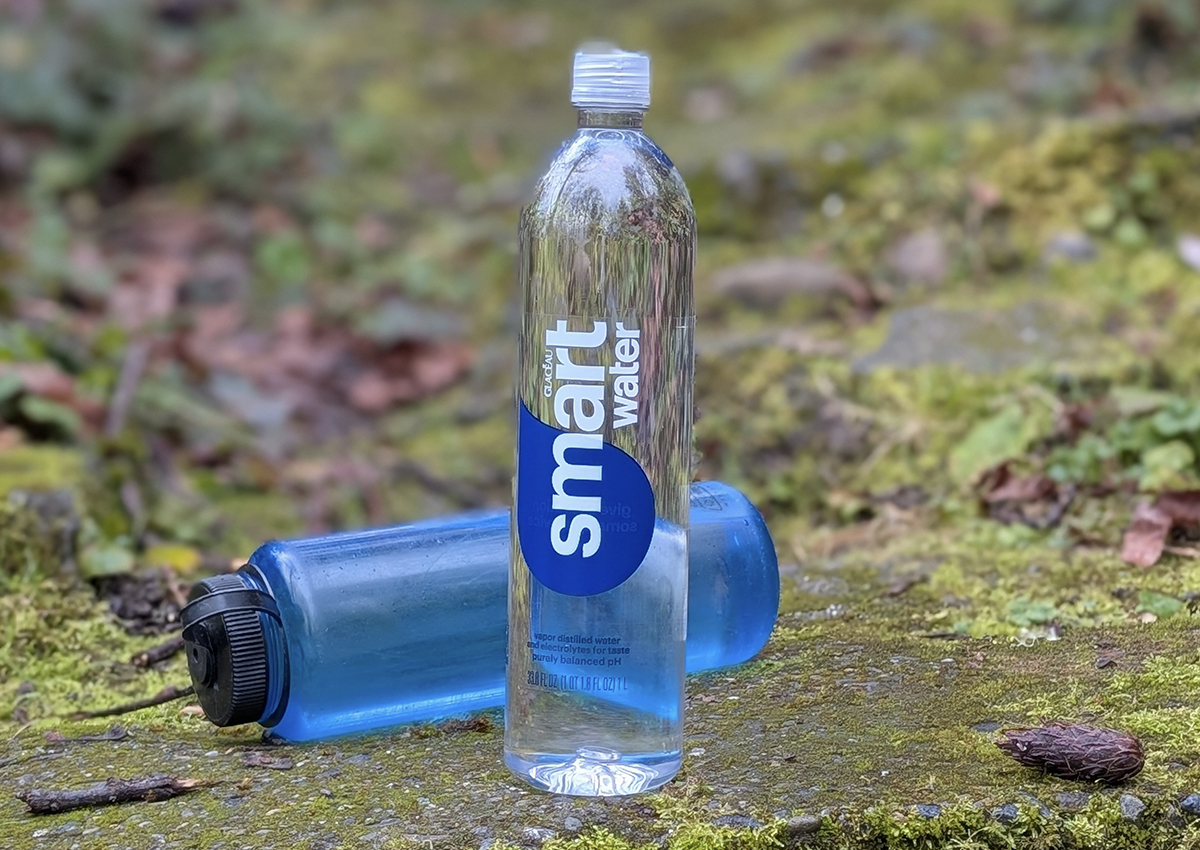 smartwater bottle standing proud with a fallen nalgene in the background