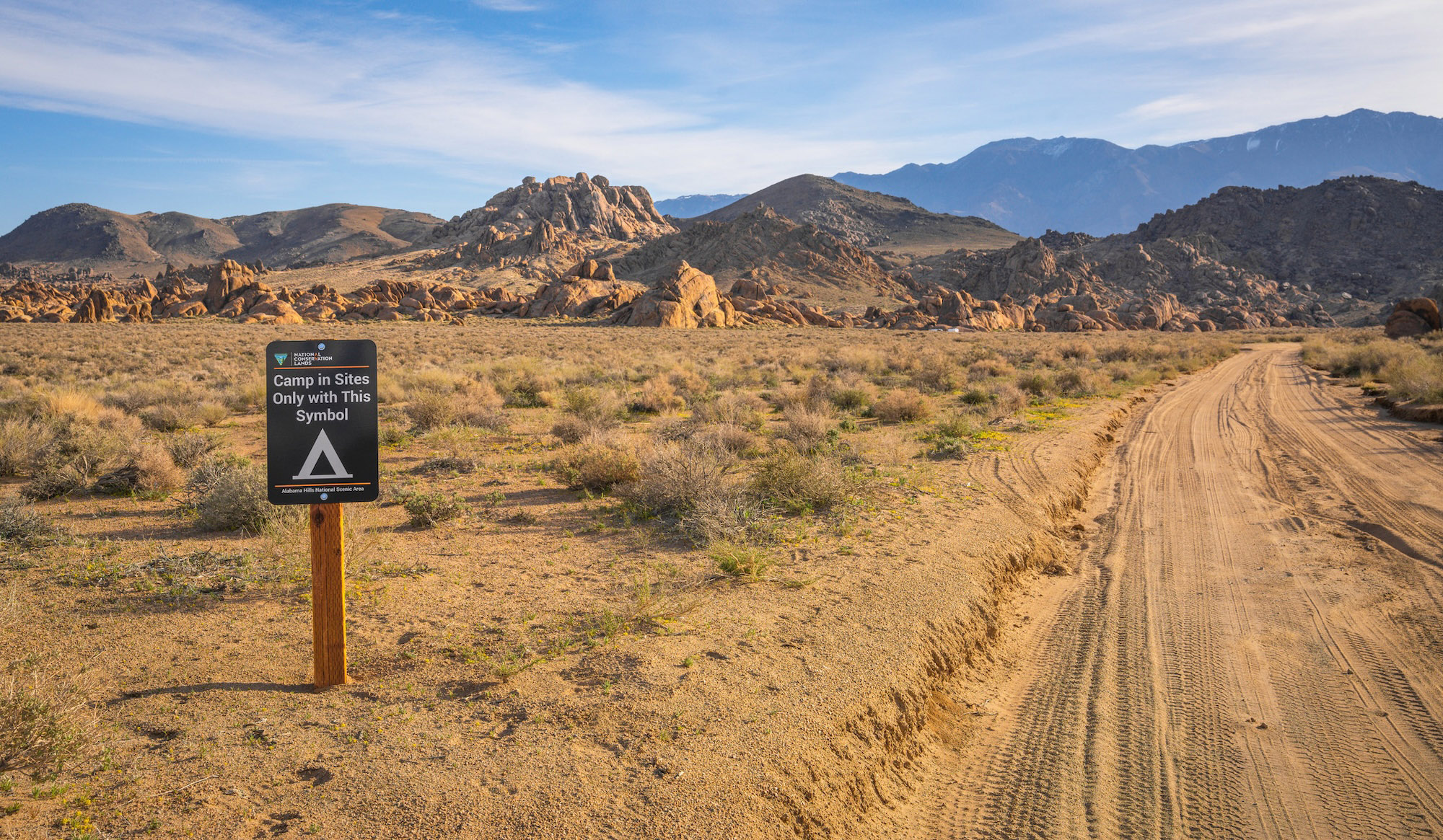 A road with public land BLM sign