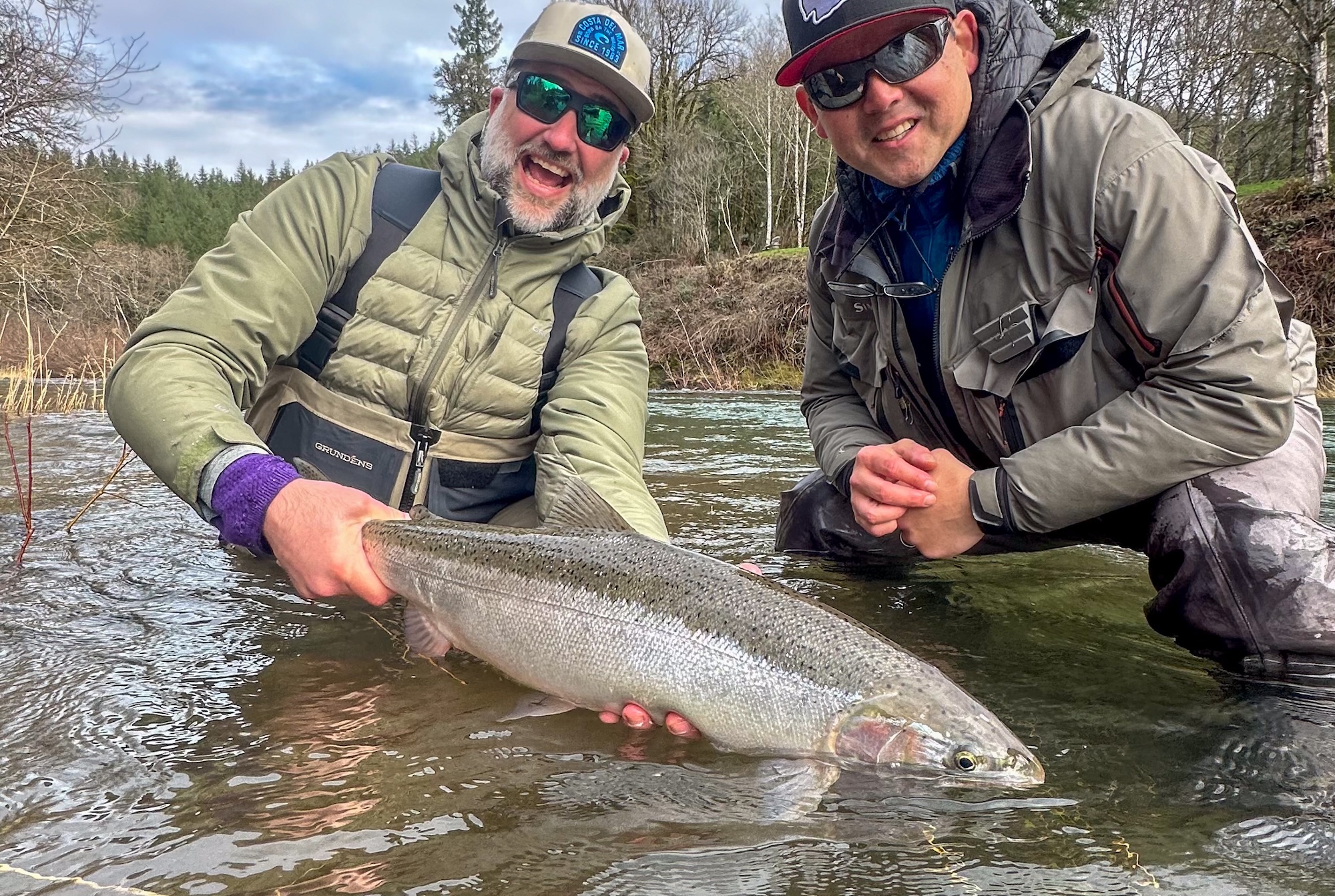 Two guys with a West Coast steelhead.