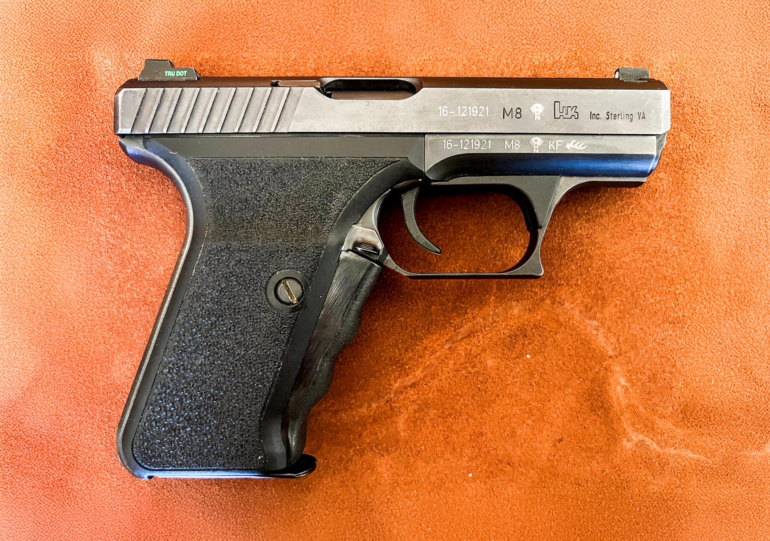 An HK pistol with proof marks on it.