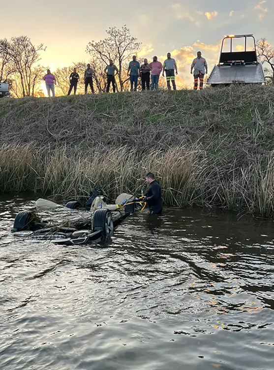 Winching a Honda out of a river.