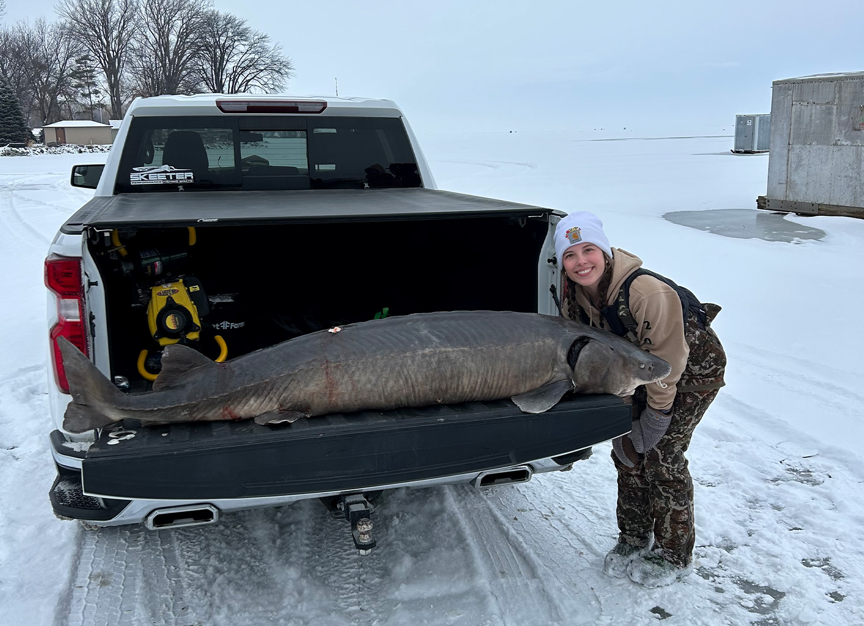 Near-Record Sturgeon Pulled Through the Ice Was So Big It Took Two Spears to Land