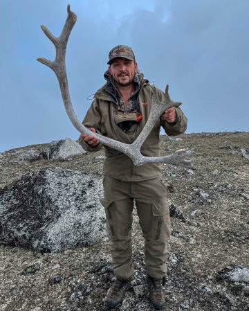 Michael Beaulieu with a caribou